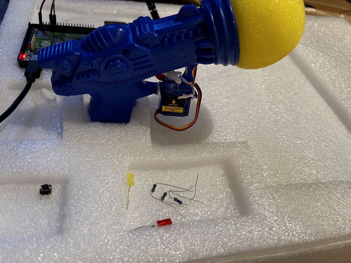 A robotic target rig built on a Raspberry Pi with a toy gun base